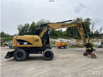 Колёсный экскаватор CAT M313D with tipping wagon and attachments (VIDEO): фото 3