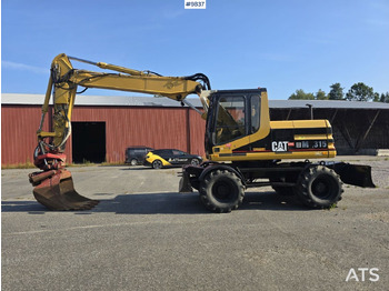 Колёсный экскаватор CATERPILLAR M315