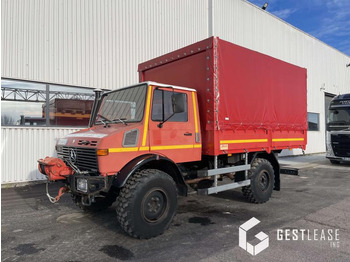 Тентованный грузовик UNIMOG