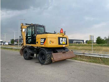 Колёсный экскаватор CATERPILLAR M313D