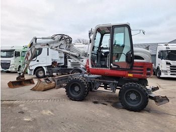 Колёсный экскаватор TAKEUCHI