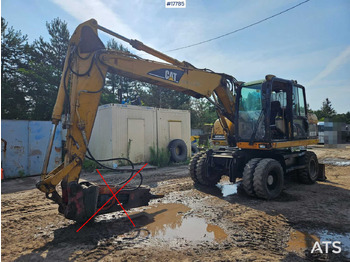 Колёсный экскаватор CATERPILLAR M313C