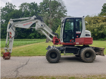 Колёсный экскаватор TAKEUCHI