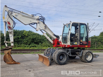 Колёсный экскаватор TAKEUCHI