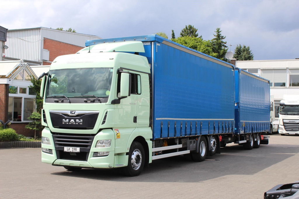 MAN TGX 26.460 Retarder Jumbo-Zug 120M3 Durchlade - Тентованный грузовик: фото 1 MAN TGX 26.460 Retarder Jumbo-Zug 120M3 Durchlade - Тентованный грузовик: фото 1