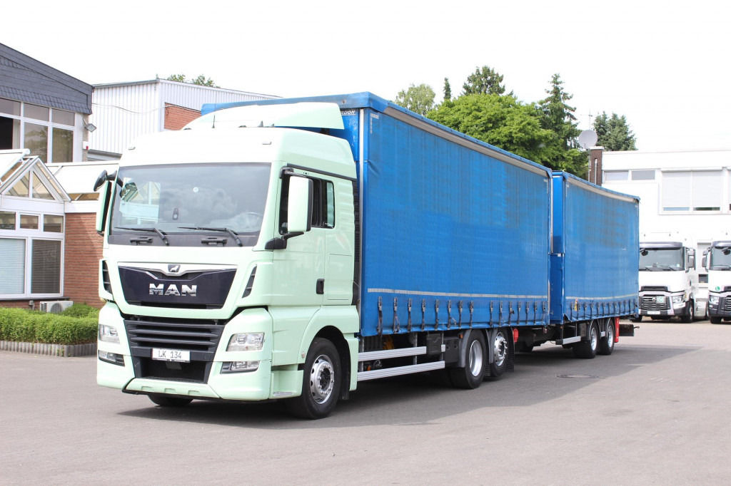 MAN TGX26.460 Durchlad Plane-Jumbo Retarder Hubdach - Тентованный грузовик: фото 1 MAN TGX26.460 Durchlad Plane-Jumbo Retarder Hubdach - Тентованный грузовик: фото 1