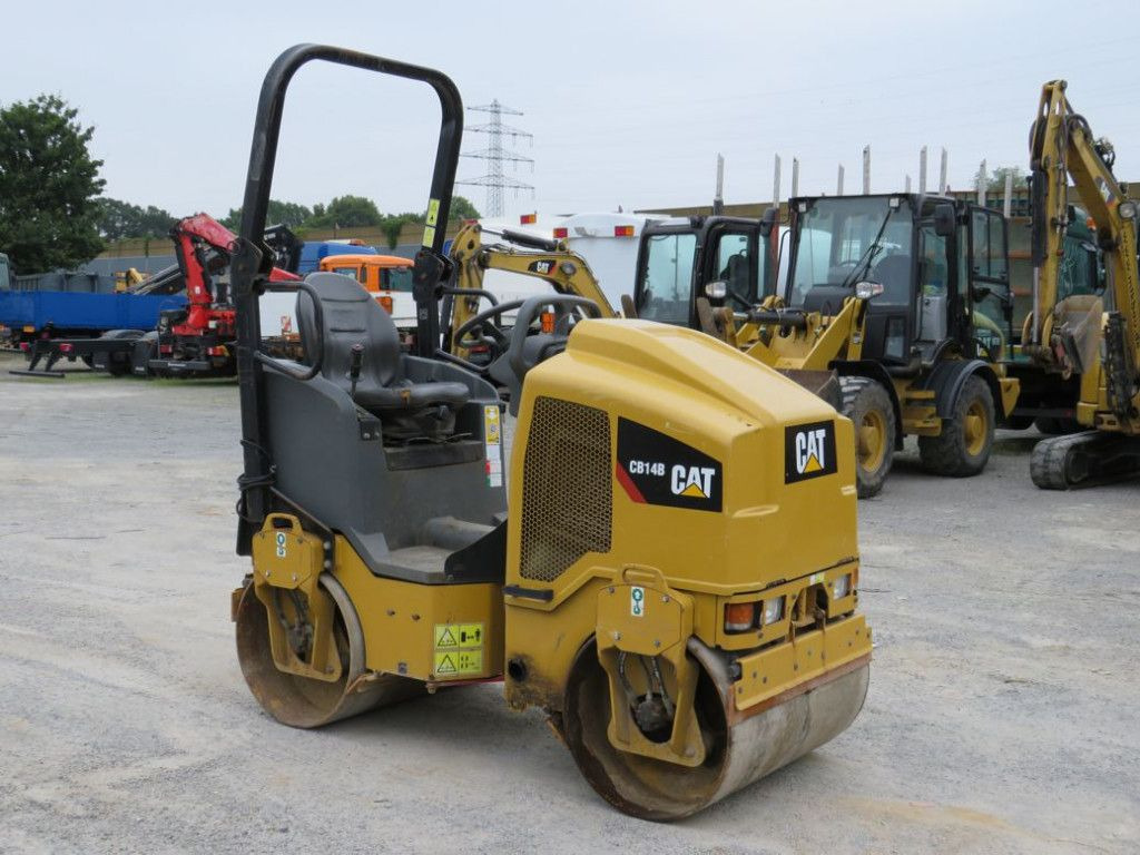 CAT Tandem-Vibrationswalze CB14 B Baumaschine - Каток: фото 2 CAT Tandem-Vibrationswalze CB14 B Baumaschine - Каток: фото 2