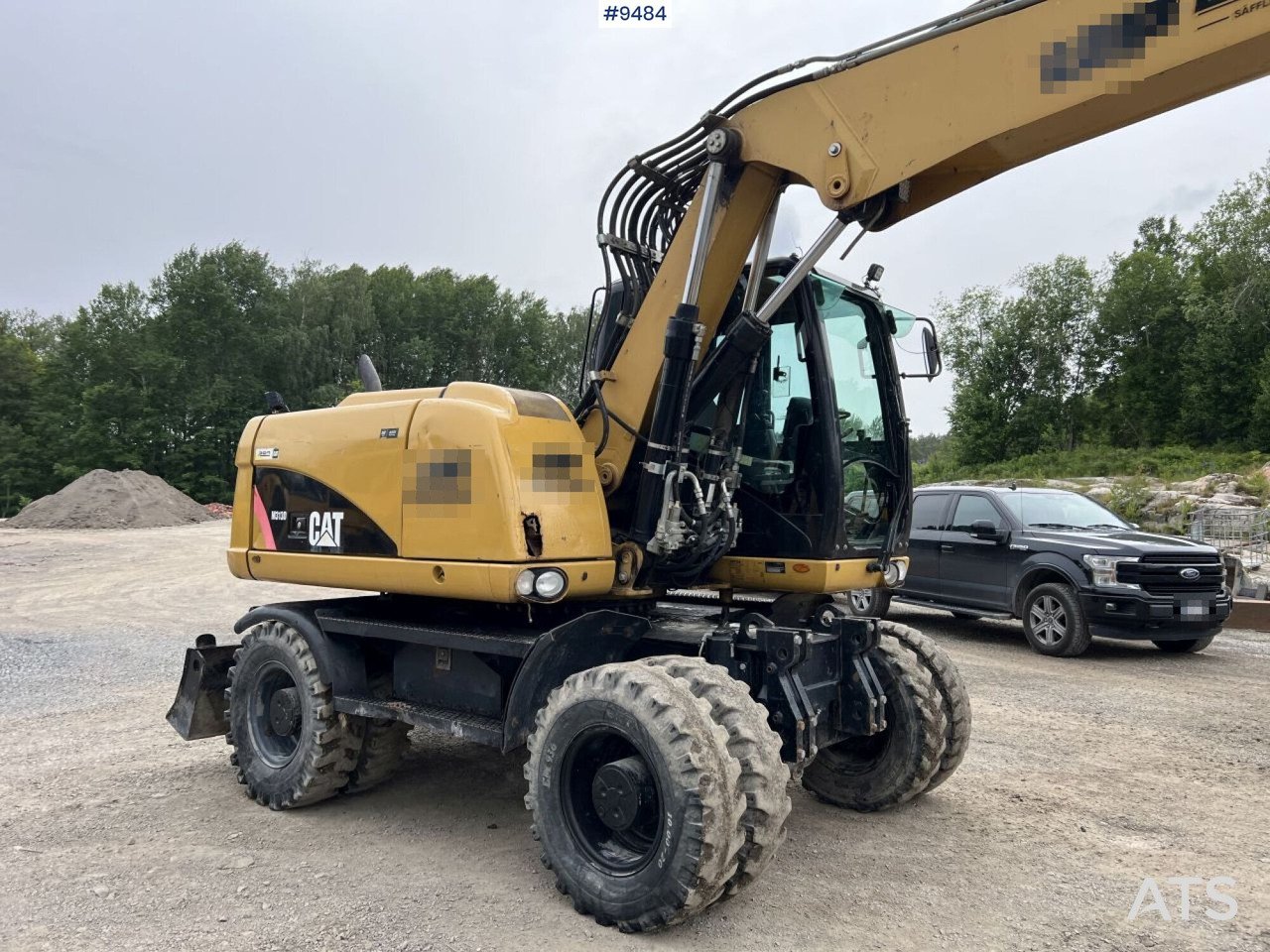 Колёсный экскаватор CAT M313D with tipping wagon and attachments (VIDEO): фото 11