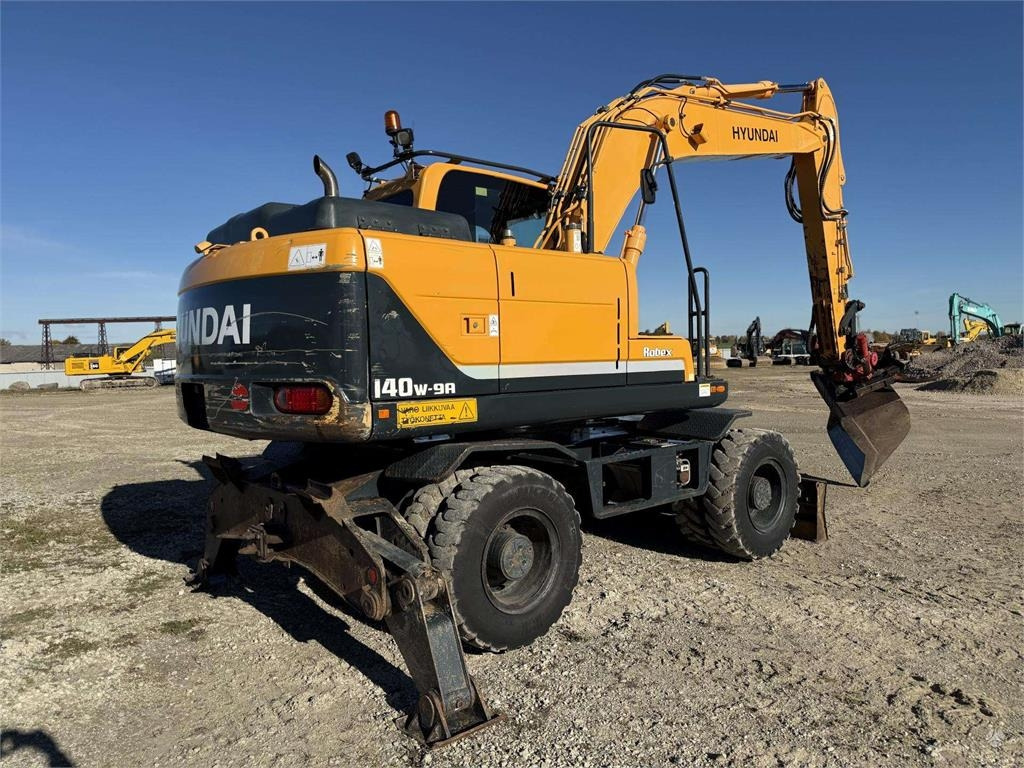 Hyundai Robex 140 W-9A Rototilt + grap - Колёсный экскаватор: фото 4 Hyundai Robex 140 W-9A Rototilt + grap - Колёсный экскаватор: фото 4