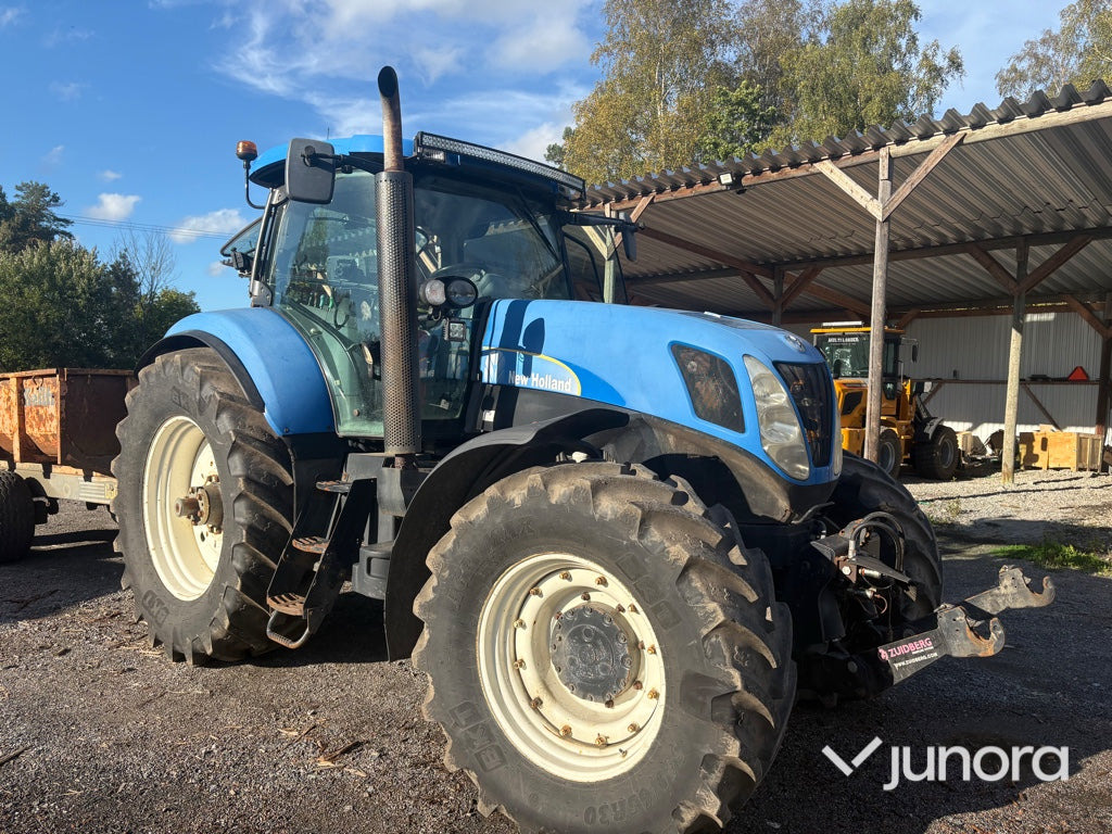 Traktor New Holland T7040 - Трактор: фото 1 Traktor New Holland T7040 - Трактор: фото 1