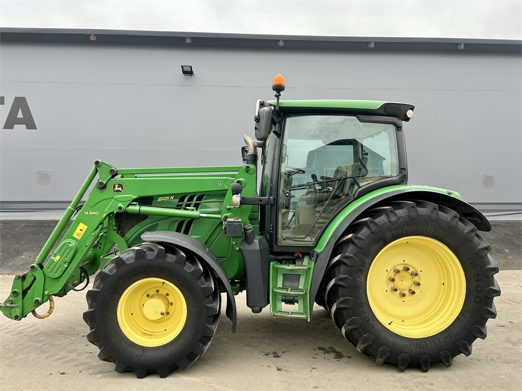 John Deere 6125 R AUTOPOWER ETUKUORMAAJALLA  - Трактор: фото 1 John Deere 6125 R AUTOPOWER ETUKUORMAAJALLA  - Трактор: фото 1