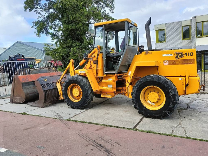 JCB 410 shovel wiellader loader + 2 bakken 4x4 robuust - Колёсный погрузчик: фото 1 JCB 410 shovel wiellader loader + 2 bakken 4x4 robuust - Колёсный погрузчик: фото 1