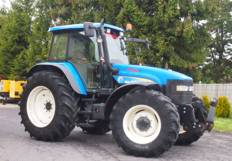 Ciągnik New Holland TM 140 2004 Przedni TUZ - Трактор: фото 1 Ciągnik New Holland TM 140 2004 Przedni TUZ - Трактор: фото 1
