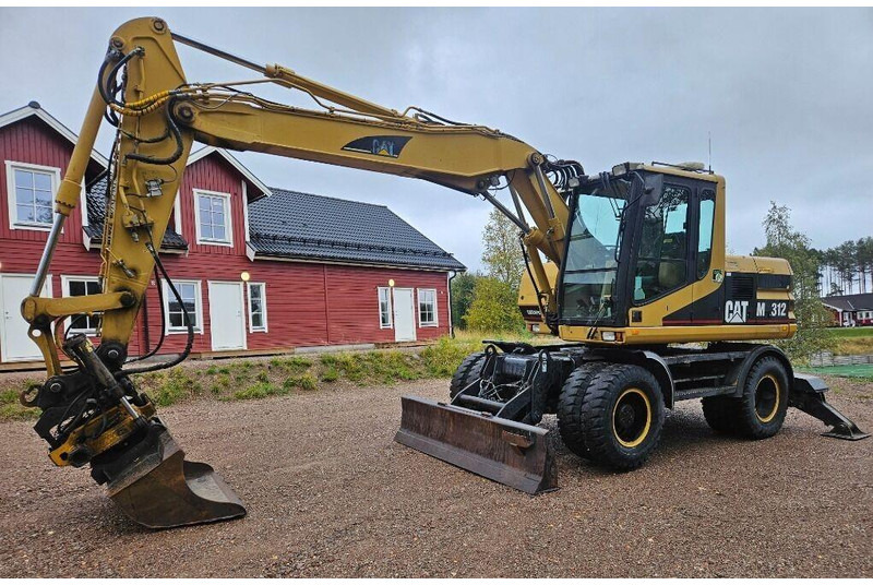 Caterpillar M312 Engcon EC20 tiltrotator - Колёсный экскаватор: фото 1 Caterpillar M312 Engcon EC20 tiltrotator - Колёсный экскаватор: фото 1