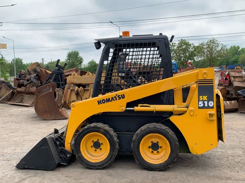Komatsu SK 510 - Мини-погрузчик с бортовым поворотом: фото 3 Komatsu SK 510 - Мини-погрузчик с бортовым поворотом: фото 3