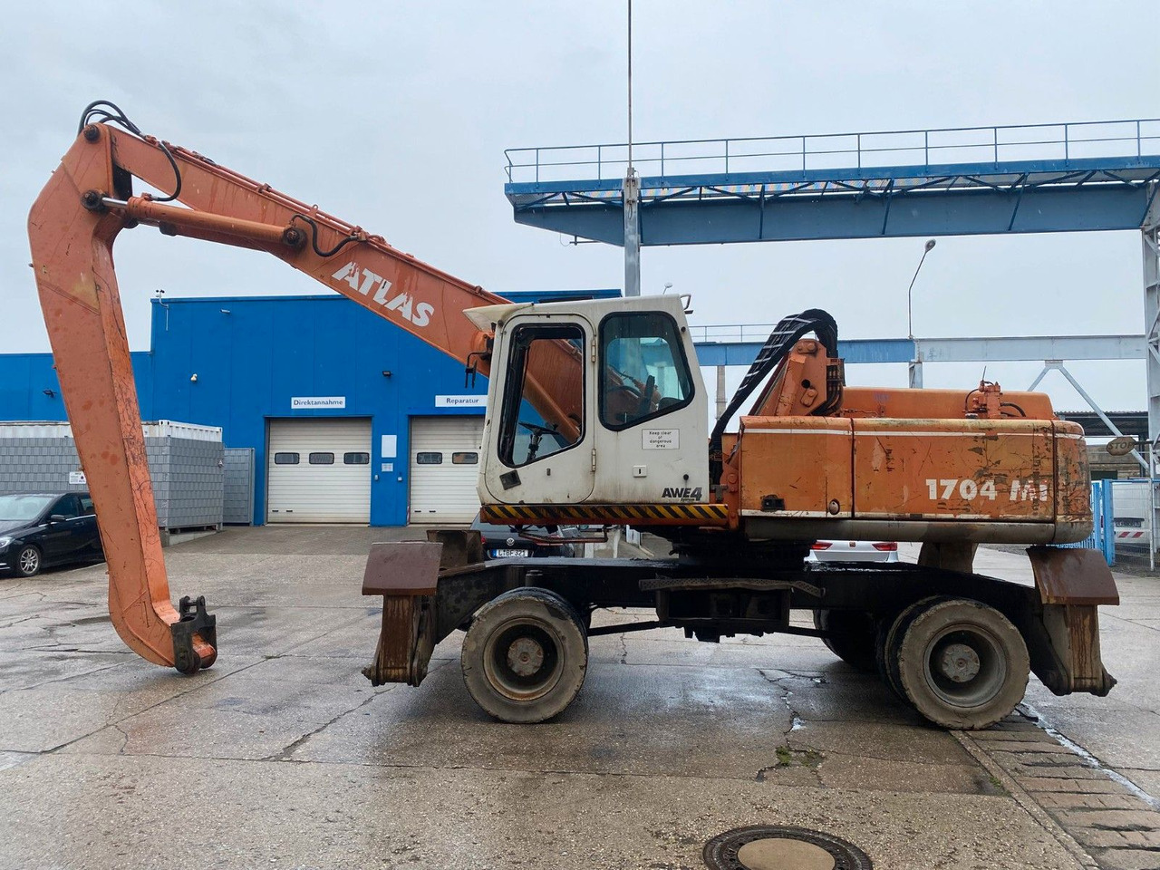 Atlas 1704 MI mit Greifer Umschlagbagger Lang - Колёсный экскаватор: фото 1 Atlas 1704 MI mit Greifer Umschlagbagger Lang - Колёсный экскаватор: фото 1