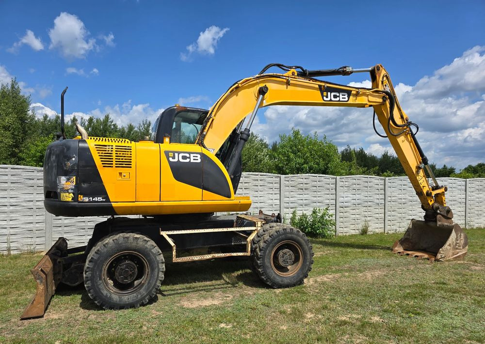JCB - Колёсный экскаватор: фото 2 JCB - Колёсный экскаватор: фото 2