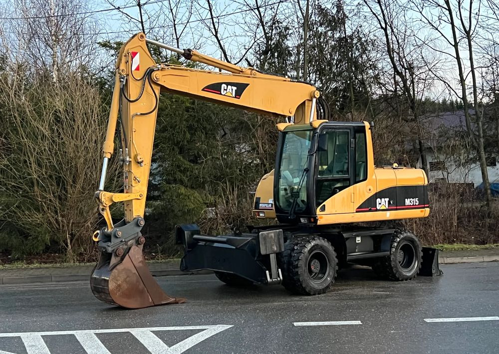 Caterpillar CAT M315C CATERPILLAR SPROWADZONY Bardzo Dobry Stan - Колёсный экскаватор: фото 1 Caterpillar CAT M315C CATERPILLAR SPROWADZONY Bardzo Dobry Stan - Колёсный экскаватор: фото 1