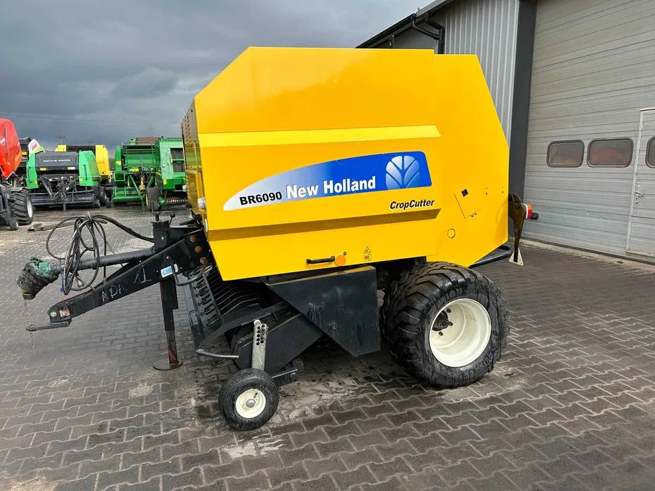 Prasa rolująca New Holland BR 6090 prasa łańcuchowa noże cropcutter - Пресс-подборщик рулонный: фото 1 Prasa rolująca New Holland BR 6090 prasa łańcuchowa noże cropcutter - Пресс-подборщик рулонный: фото 1