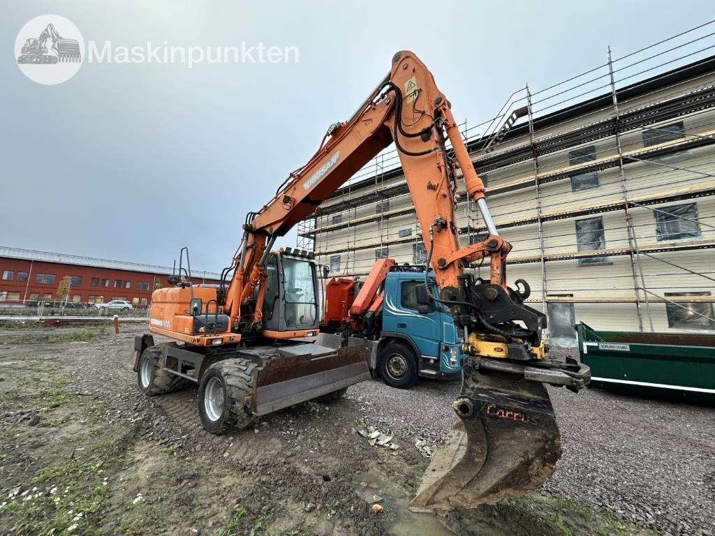 Doosan DX 140 W med vagn och redskap - Колёсный экскаватор: фото 2 Doosan DX 140 W med vagn och redskap - Колёсный экскаватор: фото 2
