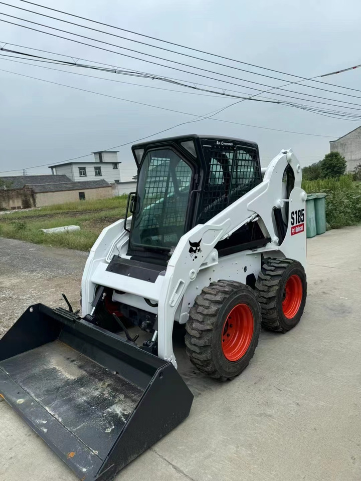 BOBCAT S185 - Мини-погрузчик с бортовым поворотом: фото 1 BOBCAT S185 - Мини-погрузчик с бортовым поворотом: фото 1