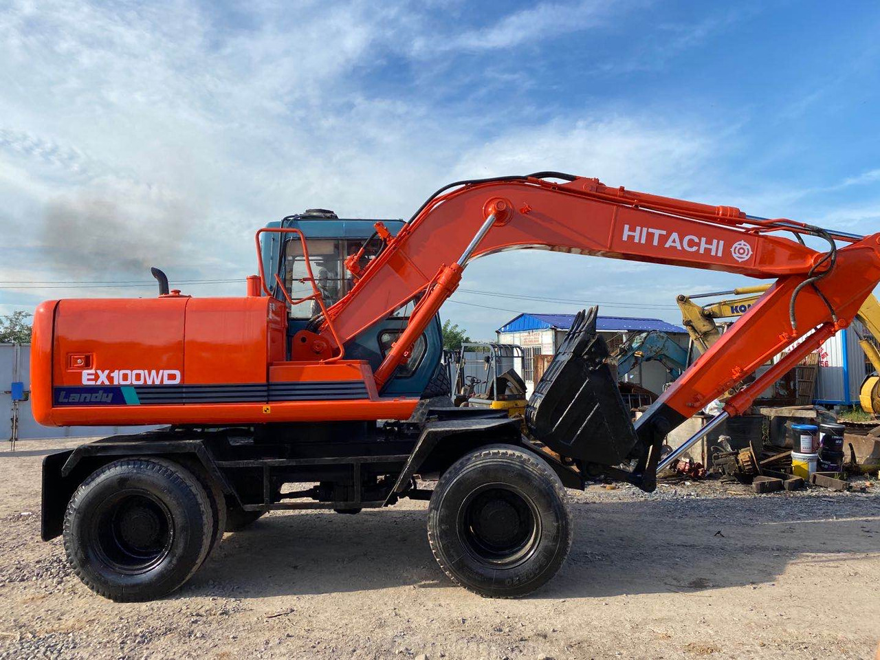 HITACHI EX100WD - Колёсный экскаватор: фото 1 HITACHI EX100WD - Колёсный экскаватор: фото 1