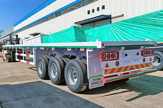 TITAN 3 Axle 40 Ft Flatbed Trailer for Sale in Mauritania - Полуприцеп-контейнеровоз/ Сменный кузов: фото 1 TITAN 3 Axle 40 Ft Flatbed Trailer for Sale in Mauritania - Полуприцеп-контейнеровоз/ Сменный кузов: фото 1