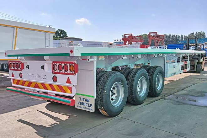 TITAN 3 Axle 40 Ft Flatbed Trailer for Sale in Mauritania - Полуприцеп-контейнеровоз/ Сменный кузов: фото 2 TITAN 3 Axle 40 Ft Flatbed Trailer for Sale in Mauritania - Полуприцеп-контейнеровоз/ Сменный кузов: фото 2