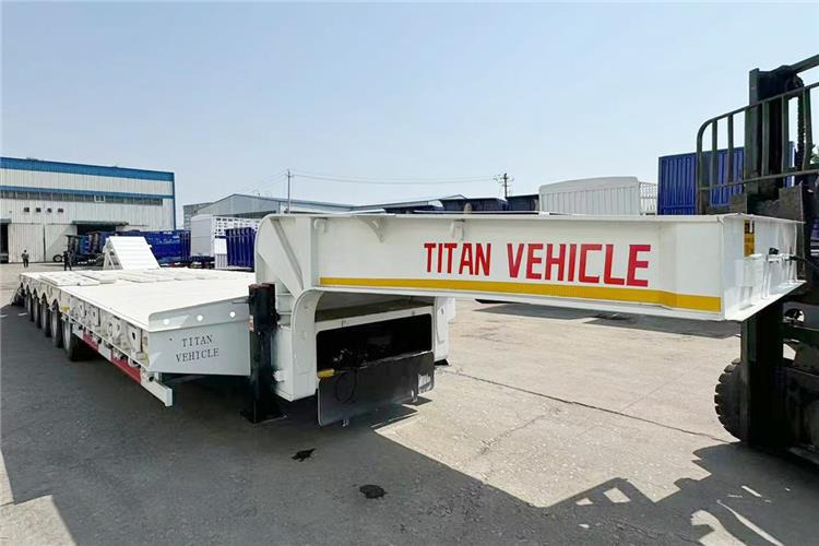 TITAN 5 Axle 100 Ton Low Bed Trailer for Sale In Tanzania - Низкорамный полуприцеп: фото 5 TITAN 5 Axle 100 Ton Low Bed Trailer for Sale In Tanzania - Низкорамный полуприцеп: фото 5