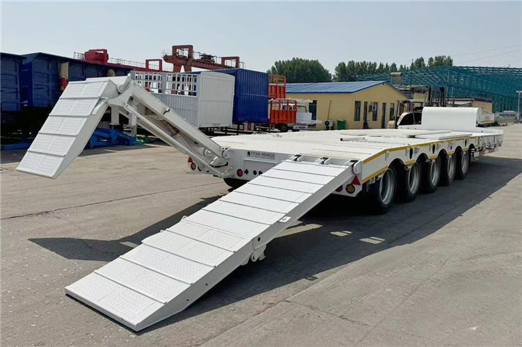TITAN 5 Axle 100 Ton Low Bed Trailer for Sale In Tanzania - Низкорамный полуприцеп: фото 2 TITAN 5 Axle 100 Ton Low Bed Trailer for Sale In Tanzania - Низкорамный полуприцеп: фото 2