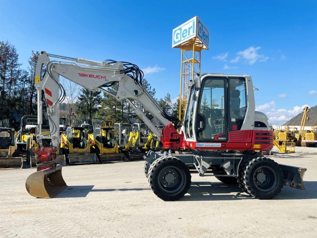 Takeuchi TB295W (3964) - Колёсный экскаватор: фото 1 Takeuchi TB295W (3964) - Колёсный экскаватор: фото 1