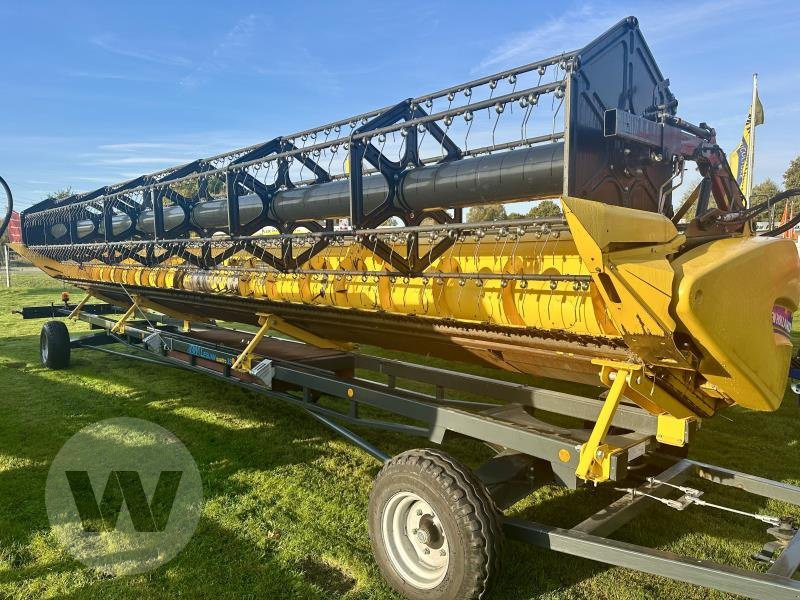 New Holland Schneidwerk 10,70 m - Жатка зерновая: фото 3 New Holland Schneidwerk 10,70 m - Жатка зерновая: фото 3