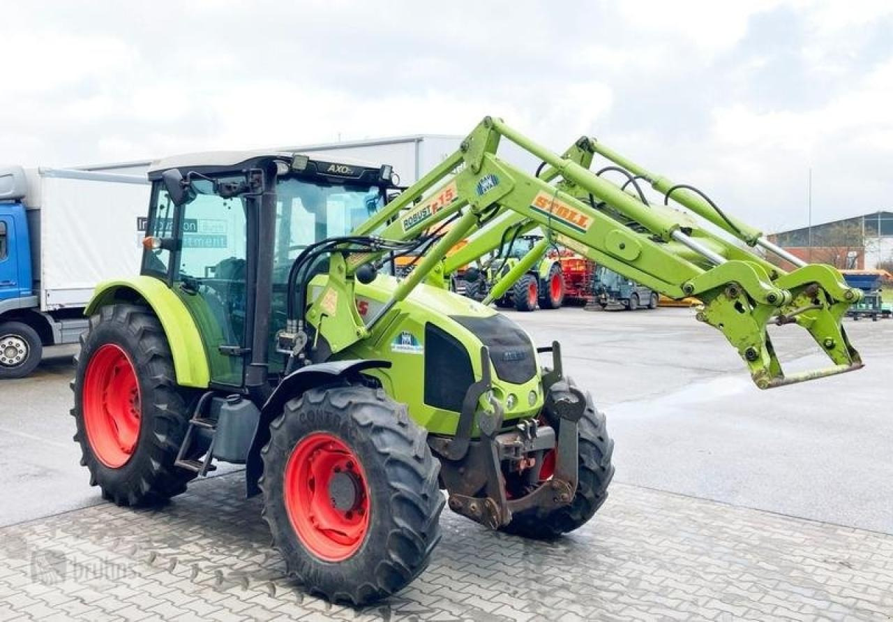 CLAAS axos 320 mit stoll frontlader - Трактор: фото 1 CLAAS axos 320 mit stoll frontlader - Трактор: фото 1