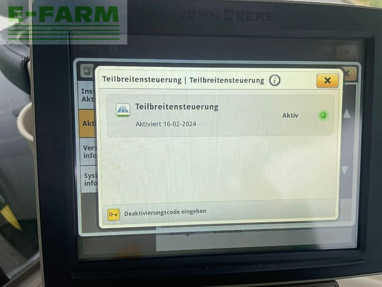 Трактор John Deere 6215r: фото 17