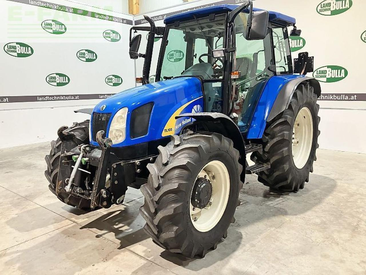 New Holland tl100a (4wd) A - Трактор: фото 1 New Holland tl100a (4wd) A - Трактор: фото 1