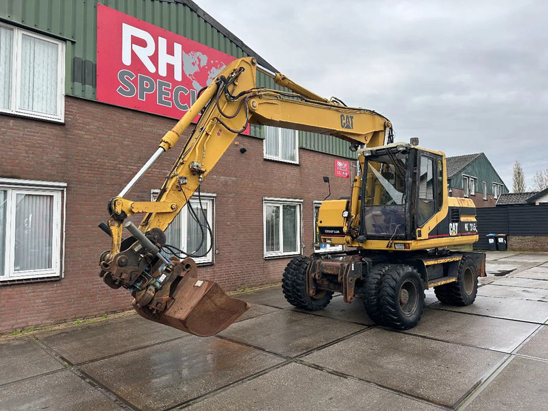 Caterpillar M315 +ROTO CE - Колёсный экскаватор: фото 2 Caterpillar M315 +ROTO CE - Колёсный экскаватор: фото 2