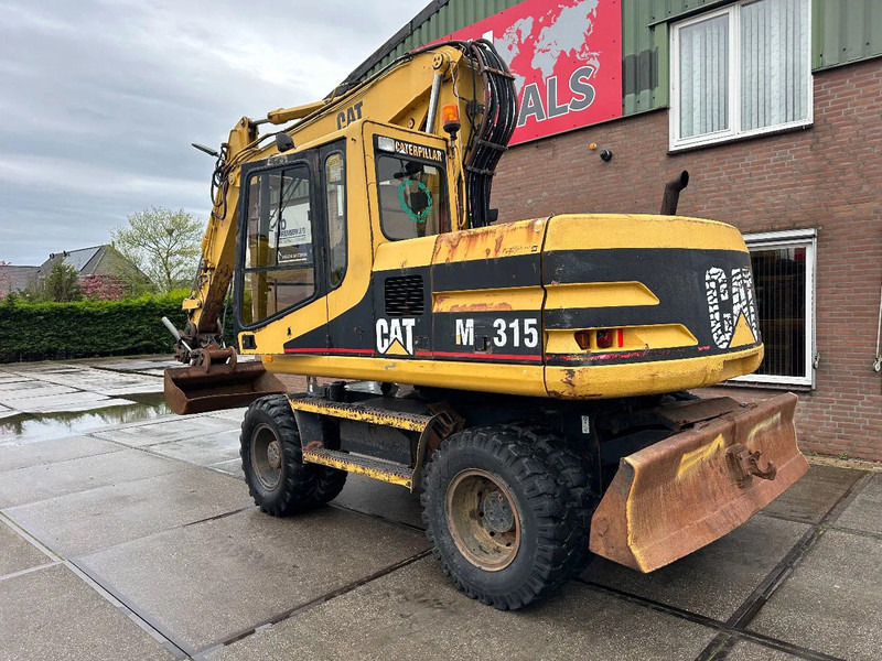 Caterpillar M315 +ROTO CE - Колёсный экскаватор: фото 4 Caterpillar M315 +ROTO CE - Колёсный экскаватор: фото 4