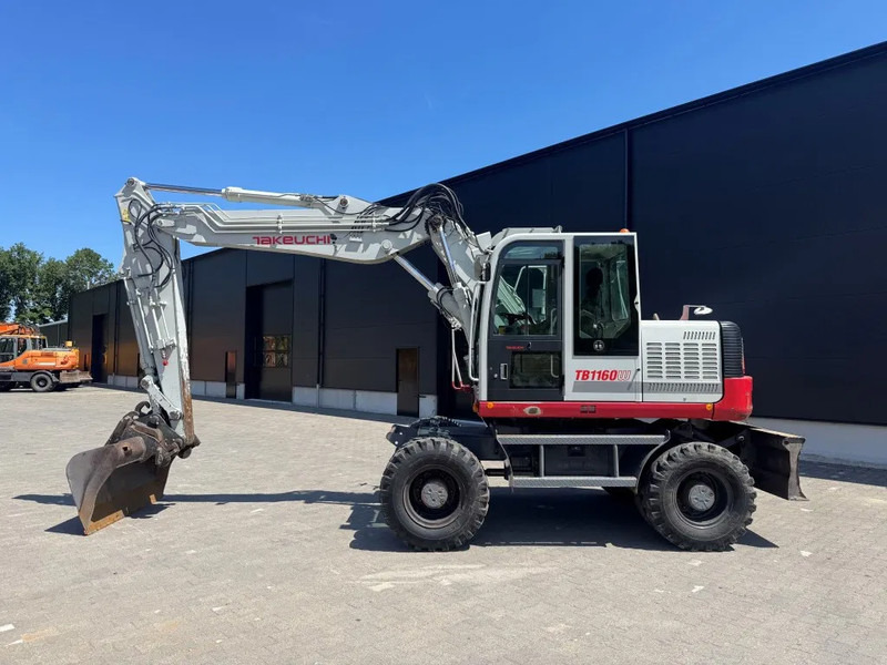 Takeuchi TB1160W - Колёсный экскаватор: фото 1 Takeuchi TB1160W - Колёсный экскаватор: фото 1